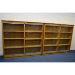 A PAIR OF EARLY TO MID 20TH CENTURY ASH DOUBLE SIZED GLAZED BOOKCASE, with carved foliate