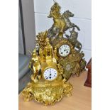 TWO LATE 19TH CENTURY GILT METAL FIGURAL MANTEL CLOCKS, the taller clock with a Middle Eastern