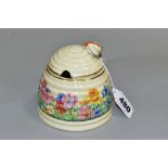 A CLARICE CLIFF FOR NEWPORT POTTERY HONEYPOT AND COVER, with painted bee finial, the body