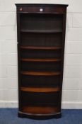 A MODERN MAHOGANY BOWFRONT OPEN BOOKCASE, with five adjustable shelves, width 78cm x depth 37cm x