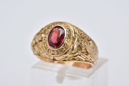 A TIFFANY & CO COLLEGE RING, designed with a central oval cut Garnet within a collet mount inscribed