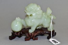 A CHINESE HARDSTONE TEMPLE DOG OF FO WITH PAW RESTING ON A BALL, height approximately 9cm,