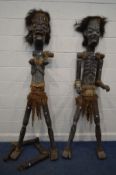 A PAIR OF MALE AND FEMALE STANDING LIFESIZE TRIBAL FIGURES, with spears largest height 207cm (both