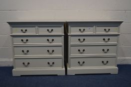 A PAIR OF CREAM FINISH CHEST OF TWO SHORT OVER THREE LONG GRDUATING DRAWERS, with swan neck handles,