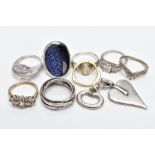 EIGHT WHITE METAL RINGS AND A PENDANT, eight rings of various designs such as a large oval blue