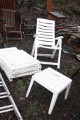 FOUR WHITE PLASTIC FOLDING GARDEN CHAIRS AND A SMALL TABLE and a small quantity of garden tools
