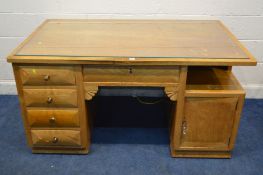 AN EARLY TO MID 20TH CENTURY ASH DESK, with five drawers, and single cupboard doors, width 156cm x