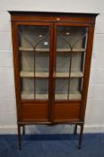 AN EDWARDIAN MAHOGANY AND STRUNG ASTRAGAL GLAZED TWO DOOR DISPLAY CABINET, on square tapering legs