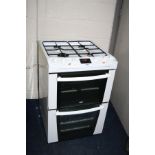 A ZANUSSI GAS COOKER with a four ring hob over a grill and an oven 60cm wide (PAT pass and