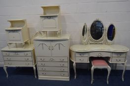 A FRENCH CREAM AND GILT SEVEN PIECE BEDROOM SUITE, comprising a kidney dressing table, with a triple