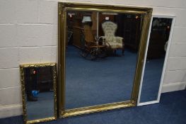 A MODERN GILT FRAMED BEVELLED EDGE WALL MIRROR, 1129cm x 106cm together with a small gilt framed