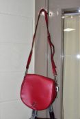 THREE LADIES HANDBAGS, comprising a red leather Karl Lagerfeld bag with shoulder strap, width 26cm x