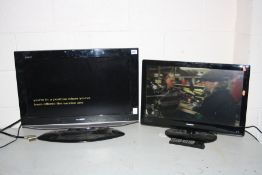 A SHARP AQUOS LC26AD 26inch TV (no remote base not secured) and a Goodmans LD2412 24ins TV with