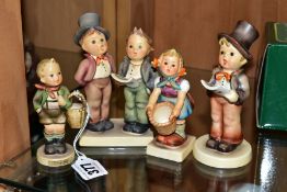 FOUR HUMMEL FIGURES AND TWO DISPLAY STANDS, 'Village Boy' HUM51, 'Little Helper' HUM73, 'Duet'