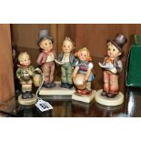 FOUR HUMMEL FIGURES AND TWO DISPLAY STANDS, 'Village Boy' HUM51, 'Little Helper' HUM73, 'Duet'