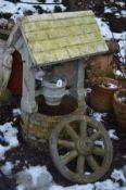 A COMPOSITE GARDEN WELL 104cm high and a wheel (2)