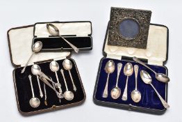 TWO CASED SETS OF SILVER TEASPOONS, A SINGLE CASED TEASPOON AND A MINIATURE SILVER PHOTOFRAME, the