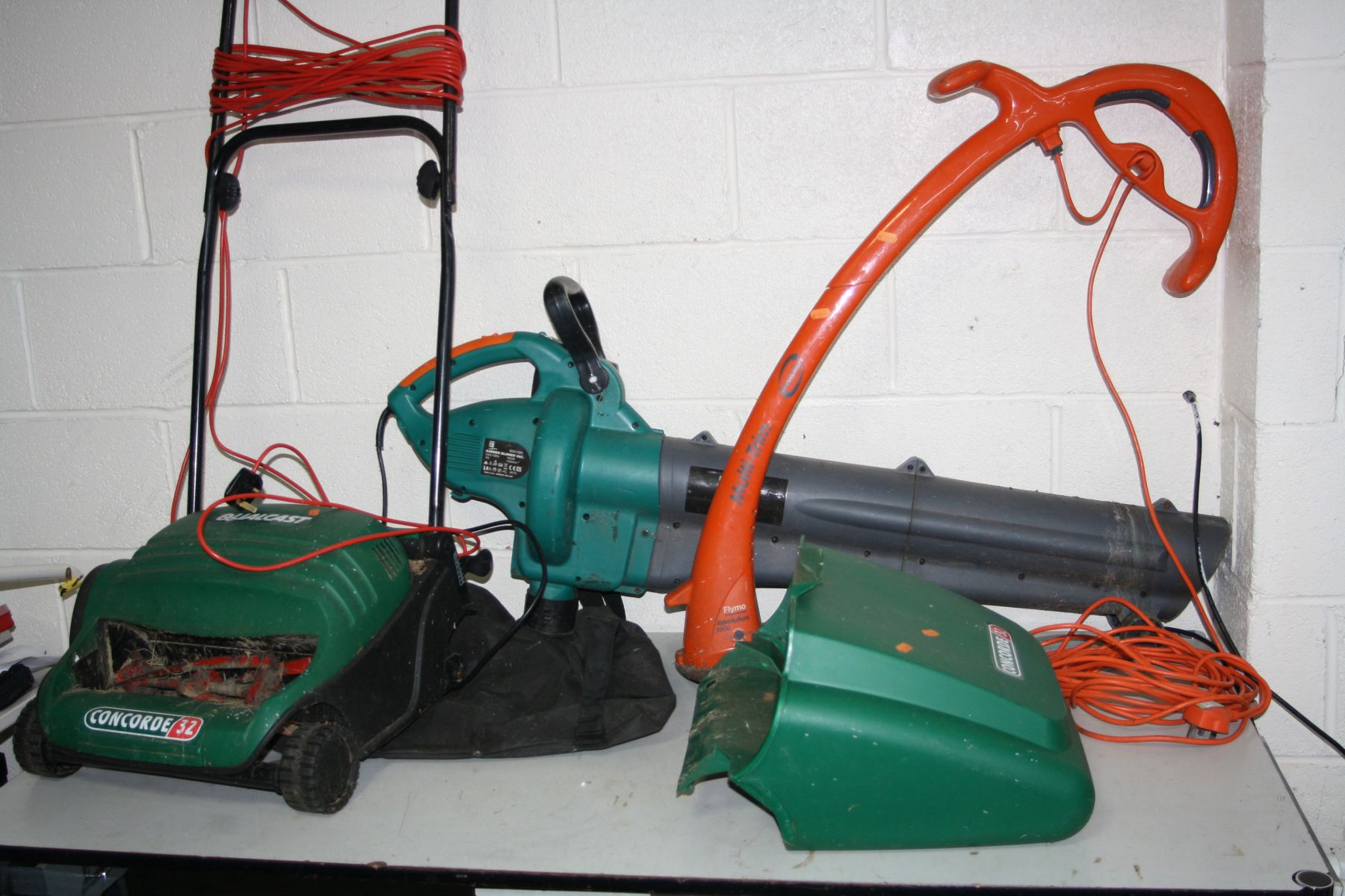 A POWERBASE GARDEN BLOWER, a Flymo Revolution 2000 strimmer and a Qualcast Concorde 32 lawn mower (