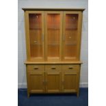 A MORRIS FURNITURE COMPANY, RANGE HORIZON, LIGHT OAK GLAZED THREE DOOR DRESSER, two glass shelves,