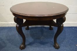 A MAHOGANY CIRCULAR CENTRE TABLE, on cabriole legs with large claw feet, united by an undershelf,