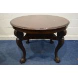 A MAHOGANY CIRCULAR CENTRE TABLE, on cabriole legs with large claw feet, united by an undershelf,