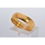 A 22CT GOLD WIDE BAND, of a plain polished design hallmarked 22ct gold London, ring size P½,