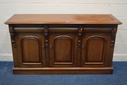 A REPRODUCTION VICTORIAN STYLE MAHOGANY SIDEBOARD, with three frieze drawers over cupboard doors,