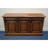 A REPRODUCTION VICTORIAN STYLE MAHOGANY SIDEBOARD, with three frieze drawers over cupboard doors,