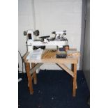 AN AXMINSTER APTC M330 WOOD LATHE total length 68cm with mandrill chuck, a set of six chisels and