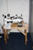 AN AXMINSTER APTC M330 WOOD LATHE total length 68cm with mandrill chuck, a set of six chisels and
