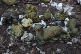 TEN COMPOSITE GARDEN FIGURES OF ANIMALS including two frog sat on a tree stump , a tortoise,