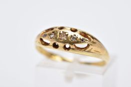 A YELLOW METAL FIVE STONE DIAMOND RING, designed with five claw set, graduated old cut and rose