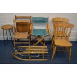 A VINTAGE BEECH SLEIGH, along with a folding director's chair, two beech folding chairs, two kitchen