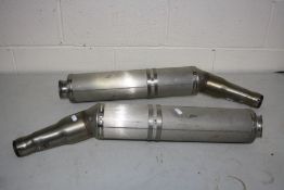 TWO APRILLA ZD41061 MOTORBIKE EXHAUST BACK BOXES appear to be unused or have had very little use