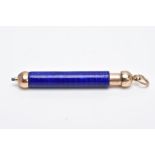 A MINIATURE YELLOW METAL AND BLUE GUILLOCHE ENAMEL RETRACTABLE PENCIL, decorated with a vivid blue