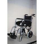 A SIMPLELIFE MOBILITY FOLDING WHEEL CHAIR with two footrests