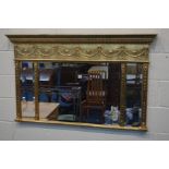 A FRENCH GILT WOOD TRIPPLE BEVELLED EDGE WALL MIRROR, width 132cm x height 81cm