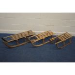 THREE VINTAGE WOODEN SLEIGHS