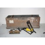 A LONG VINTAGE WOODEN TOOL BOX including a Stanley No 46 Plough plane , foot pump, shoe last etc