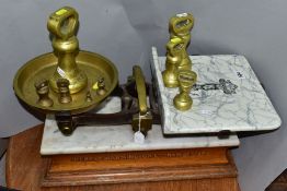 A SET OF BERRY AND WARMINGTON BALANCE SCALES, mantel on a marble topped wooden plinth, retail scales