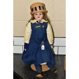 A GOSS BISQUE HEAD AND SHOULDERS DOLL, shoulders marked 'Goss 32', fixed glass eyes, open mouth