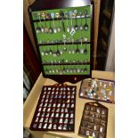 THREE WOODEN DISPLAY SHELVES OF METAL AND CERAMIC THIMBLES AND SOUVENIR SPOONS, together with a