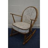 A BLONDE ERCOL MODEL 315 WINDSOR GRANDFATHER ROCKING CHAIR