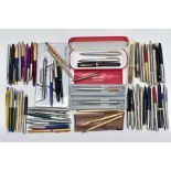 A BOX OF PENS AND RETRACTABLE PENCILS, to include a variety of ball point, fountain pens and