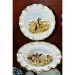 A PAIR OF ROYAL CROWN DERBY WAVY RIM CABINET PLATES, printed and tinted designs, one with huntsmen