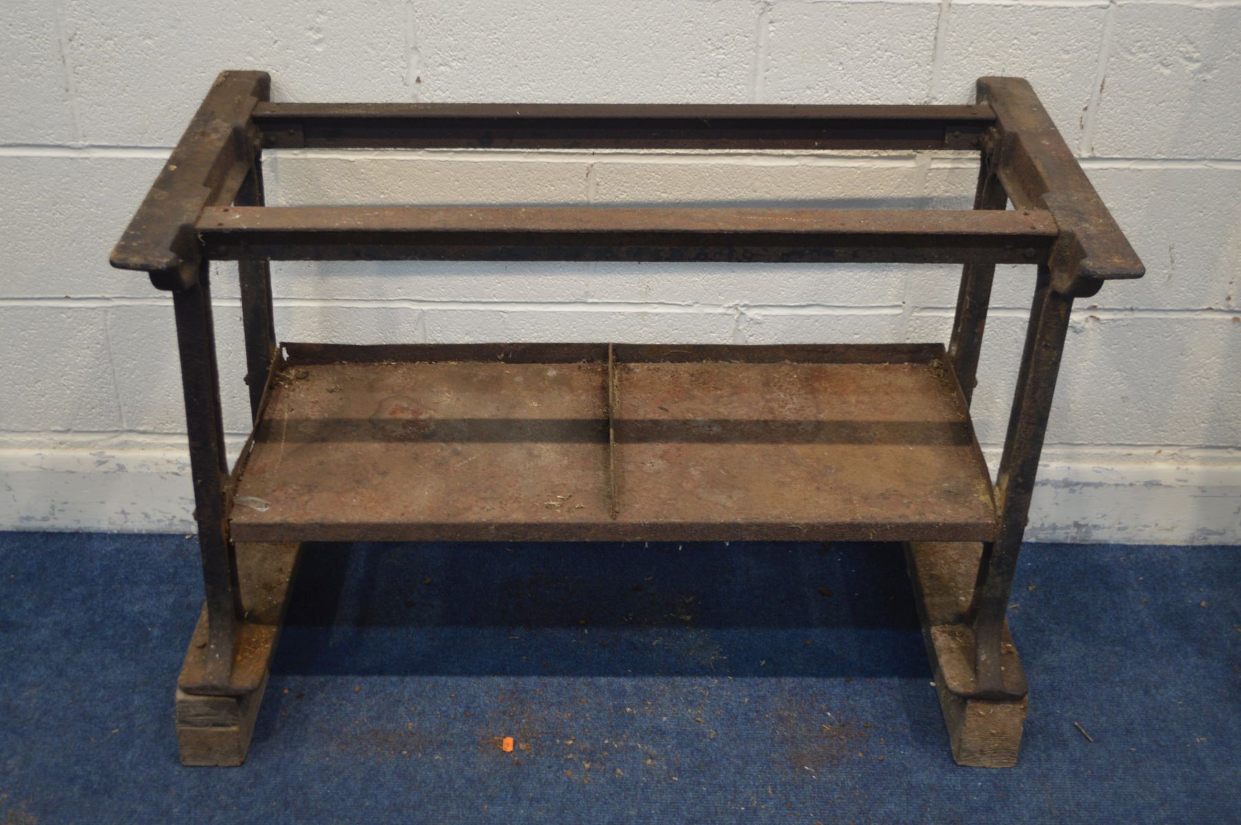 A VINTAGE CAST IRON TABLE BASE united by a undershelf, width 105cm x depth 56cm x height 73cm