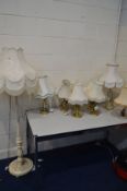 A PAINTED STANDARD LAMP, along with six various brassed table lamps, two onyx table lamps, all