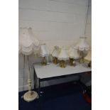 A PAINTED STANDARD LAMP, along with six various brassed table lamps, two onyx table lamps, all