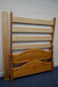 A MODERN PINE 4FT6 BED FRAME with side rails and slats