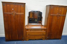 AN OAK THREE PIECE BEDROOM SUITE, comprising two double door wardrobes and a matching dressing chest